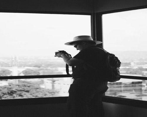 Person doing light stretching near a window